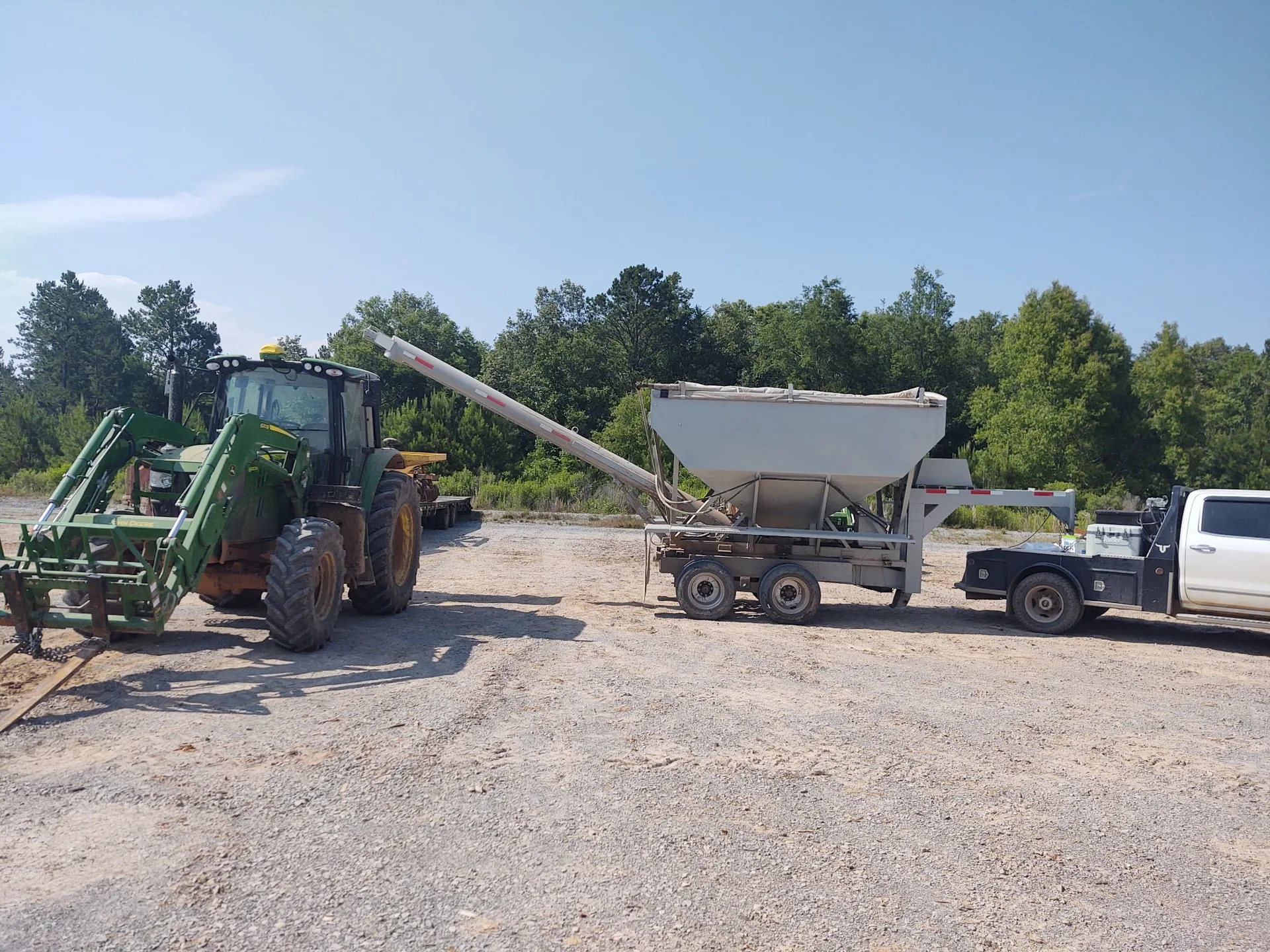 Seed and material being loaded into field equipment