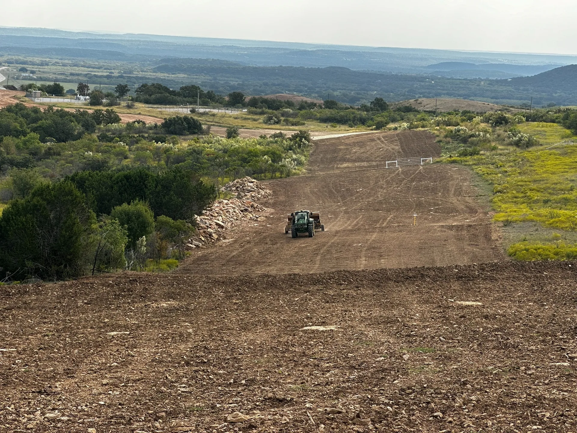 Pipeline right-of-way seeding equipment working across a corridor